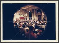 Color circle-lens photograph of the courtroom during the Iran-Contra trials, July 1987