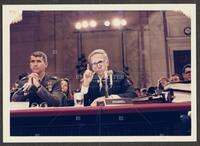 Color photograph of Lt. Col. Oliver North and counsel during the Iran-Contra trials, July 1987