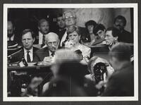 Black and white photograph of Jack Brooks, cigar in mouth, thinking during the Iran-Contra trials, July 14, 1987