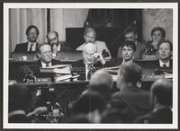 Black and white photograph of Jack Brooks rubbing his eye during the Iran-Contra trials, July 14, 1987