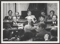 Black and white photograph of Jack Brooks resting his forehead on his hand during the Iran-Contra trials, July 14, 1987