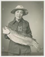 Photograph of Woman Holding a Fish