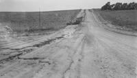 Photograph of Damaged Vehicle on a Road