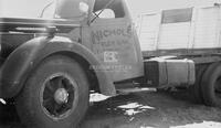 Photograph of Damaged Vehicle Lying on the Road