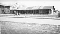 Photograph of Two Buildings Lining Road