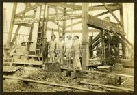 [Men Standing in Front of Republic Prod. Co. Oil Well]