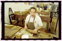 Negatives showing Alex Reyes roll cigars at the Traditional Cigar Factory, April 7, 2000