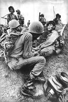 South Vietnamese medic aids wounded soldier