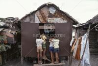 Boys watching television in the Philippines