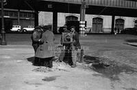 Men in street, New York, ca. 1935-1936