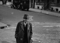 Man on street, New York, ca. 1935-1936