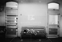 Woman sleeping in hallway, Terrell State Hospital, 1959