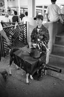 Boy with costumed goat at the Texas State Fair