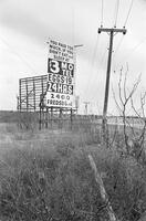 Motel billboard; Faces of Texas