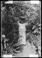 Mexican woman in garden, Matamoros, Mexico