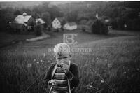 Boy Smelling Flowers