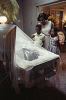 Mrs. Medgar Evers and kids at funeral home