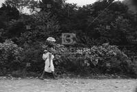 Huasteca woman carrying child