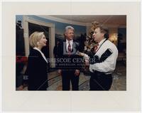 White House photographer Bob McNeely talking with President Bill Clinton and Hillary Clinton