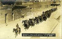 Soldiers exercising horses